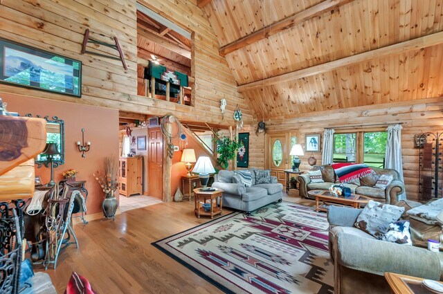20151 Ben Fly Rd, Lyles, TN 37098 - living room featuring high vaulted ceiling, log walls, wood finished floors, and a wood ceiling with exposed beams