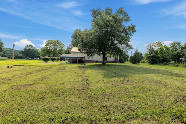 4628 Dugger Rd, Culleoka, TN 38451 - view of grassy yard with a carport