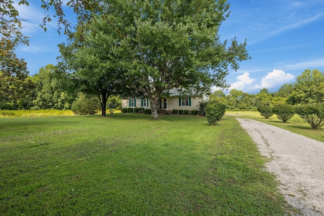 4628 Dugger Rd, Culleoka, TN 38451 - obstructed view of property featuring a front yard and gravel driveway
