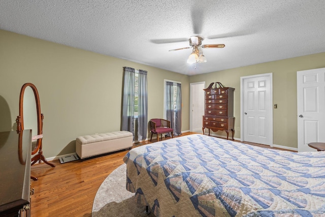 4628 Dugger Rd, Culleoka, TN 38451 - bedroom featuring wood finished floors, a textured ceiling, and ceiling fan