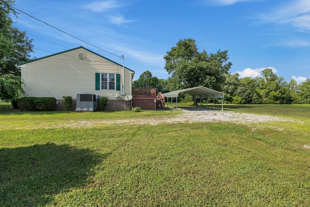 4628 Dugger Rd, Culleoka, TN 38451 - view of home's exterior with a detached carport, a lawn, driveway, and a wooden deck