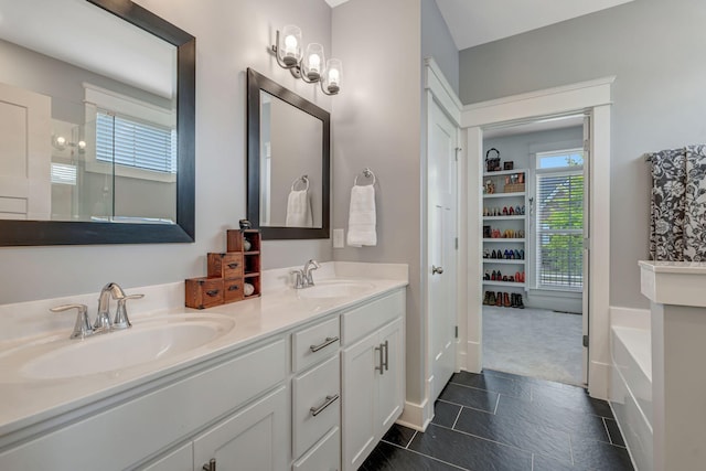 607 Beamon Dr, Franklin, TN 37064 - full bathroom featuring double vanity and a garden tub