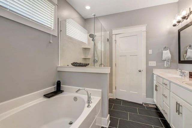 607 Beamon Dr, Franklin, TN 37064 - full bath with a bath, a shower stall, tile patterned flooring, double vanity, and recessed lighting