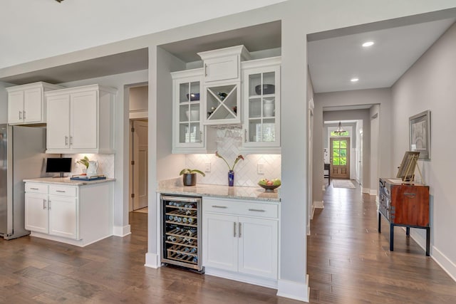 607 Beamon Dr, Franklin, TN 37064 - indoor wet bar with beverage cooler, tasteful backsplash, dark wood-type flooring, and recessed lighting