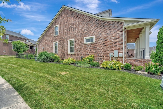 607 Beamon Dr, Franklin, TN 37064 - view of side of home featuring brick siding and a lawn