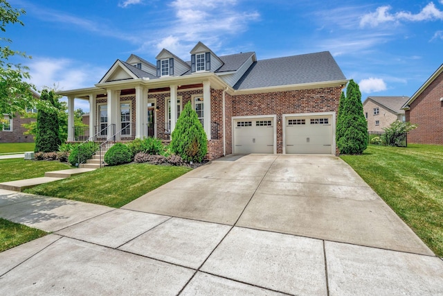 607 Beamon Dr, Franklin, TN 37064 - view of front of home with brick siding, a front yard, driveway, covered porch, and a shingled roof