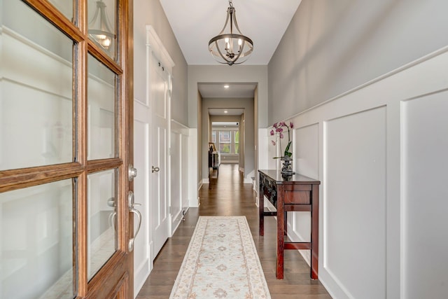 607 Beamon Dr, Franklin, TN 37064 - corridor with a chandelier, dark wood-type flooring, and a decorative wall