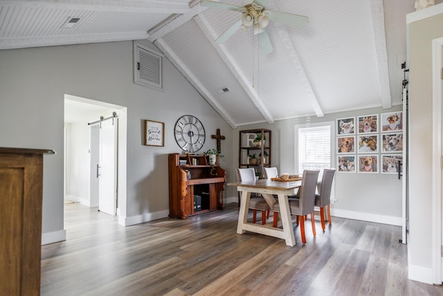 7365 Coldwater Rd, Fairview, TN 37062 - dining room featuring a barn door, a ceiling fan, wood finished floors, beamed ceiling, and high vaulted ceiling