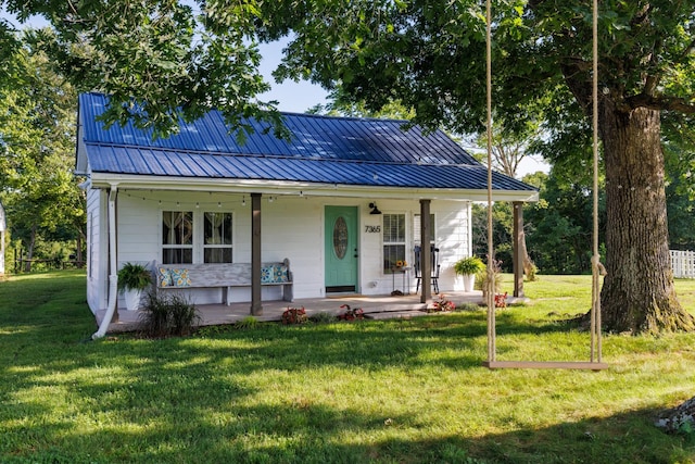 7365 Coldwater Rd, Fairview, TN 37062 - view of front of house featuring a front lawn, a porch, a metal roof, and a standing seam roof