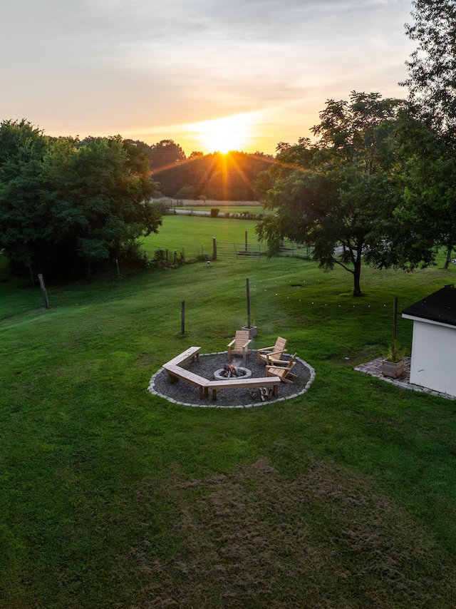 7365 Coldwater Rd, Fairview, TN 37062 - yard at dusk featuring an outdoor fire pit and a lawn