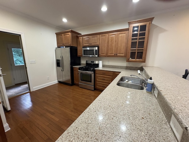 111 Reeds Ln, Sewanee, TN 37375 - kitchen with appliances with stainless steel finishes, crown molding, glass insert cabinets, dark wood finished floors, and light stone countertops