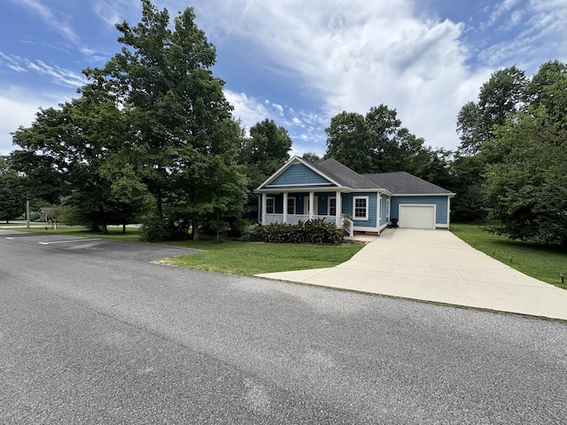 111 Reeds Ln, Sewanee, TN 37375 - view of front of property with a garage, a front yard, concrete driveway, and covered porch
