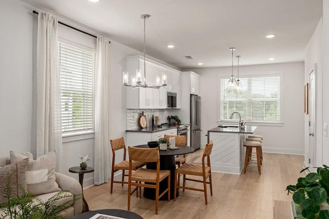 700 N Dupont Ave Unit 207, Madison, TN 37115 - dining area with a chandelier, light wood-style flooring, and recessed lighting