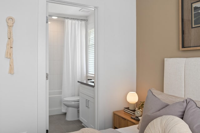 700 N Dupont Ave Unit 207, Madison, TN 37115 - tiled bedroom featuring connected bathroom
