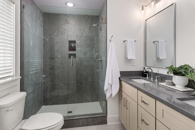 700 N Dupont Ave Unit 207, Madison, TN 37115 - full bathroom featuring double vanity, a stall shower, and tile patterned floors