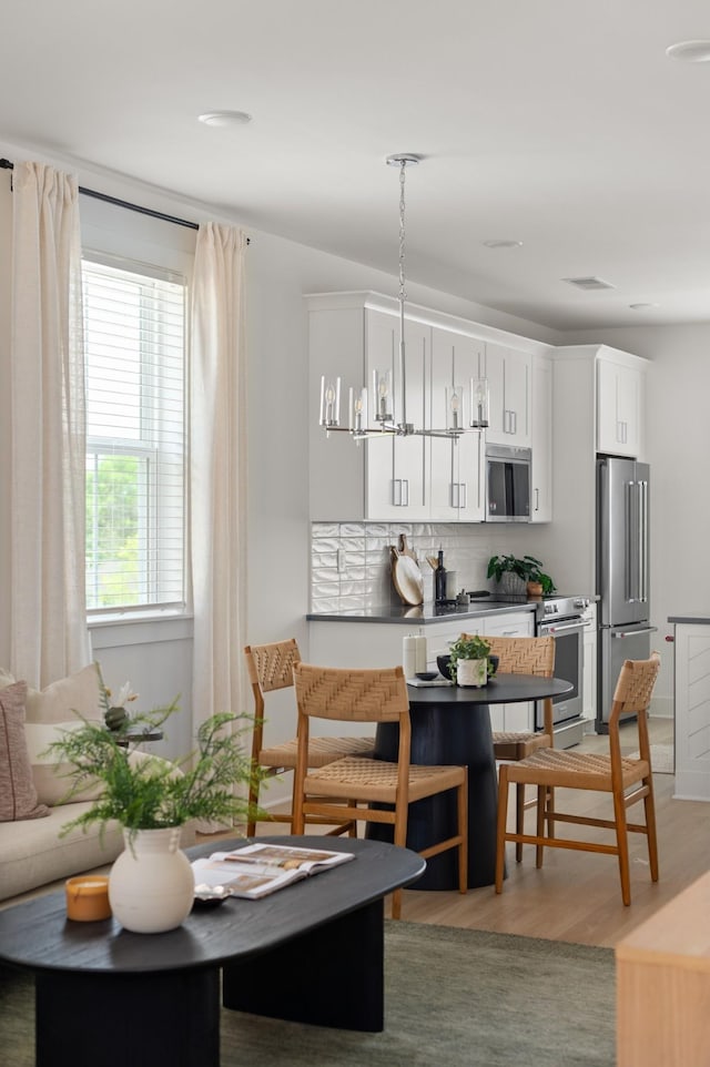 700 N Dupont Ave Unit 207, Madison, TN 37115 - dining area featuring light wood-style flooring