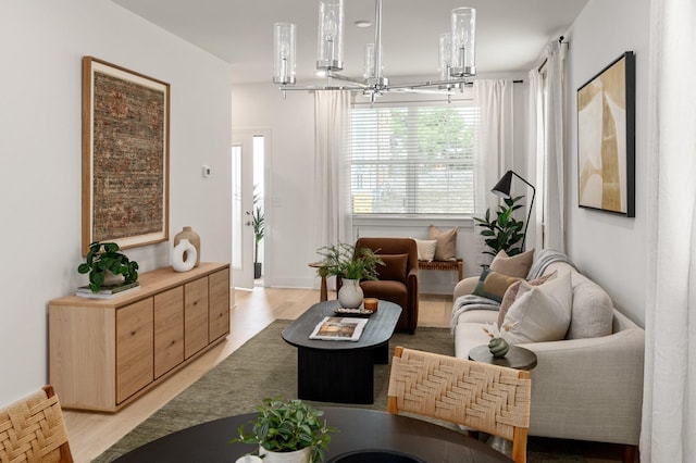 700 N Dupont Ave Unit 207, Madison, TN 37115 - living room with a chandelier and light wood-type flooring