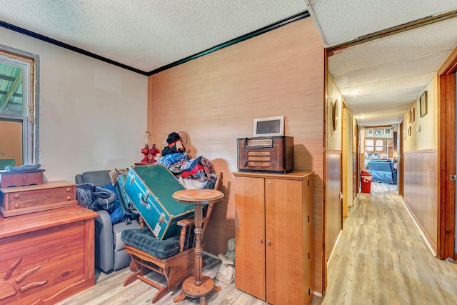 111 School St, Cumberland Furnace, TN 37051 - misc room with light wood-style flooring, a textured ceiling, and crown molding