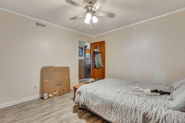 111 School St, Cumberland Furnace, TN 37051 - bedroom with light wood-type flooring, ornamental molding, a textured ceiling, and ceiling fan