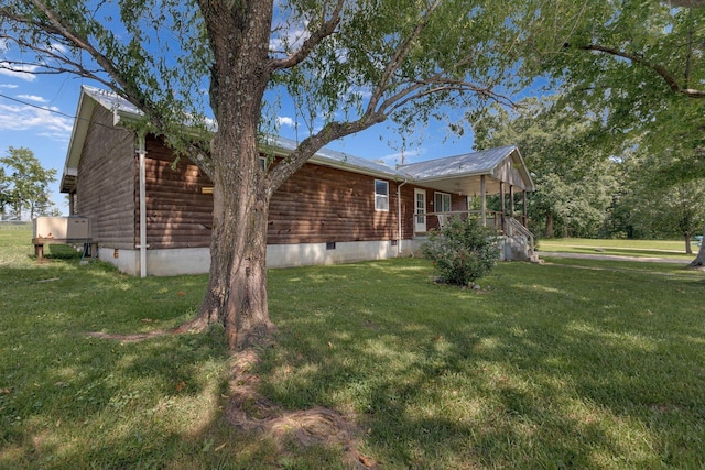 111 School St, Cumberland Furnace, TN 37051 - view of side of home with crawl space, a lawn, and covered porch