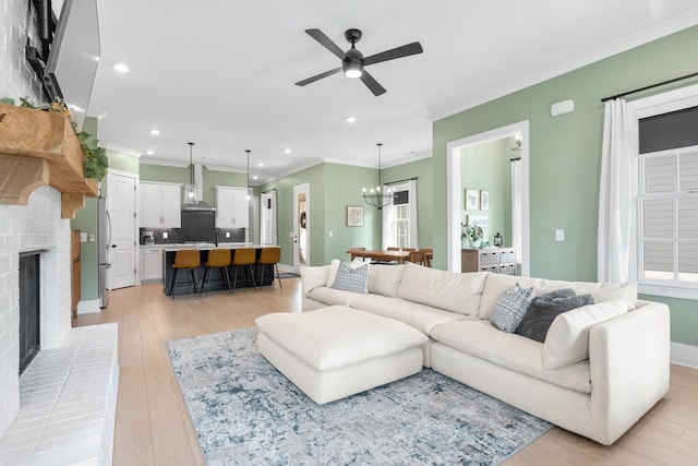 2618 Buckner Ln, Thompsons Station, TN 37179 - living room with crown molding, a ceiling fan, recessed lighting, a chandelier, and a brick fireplace