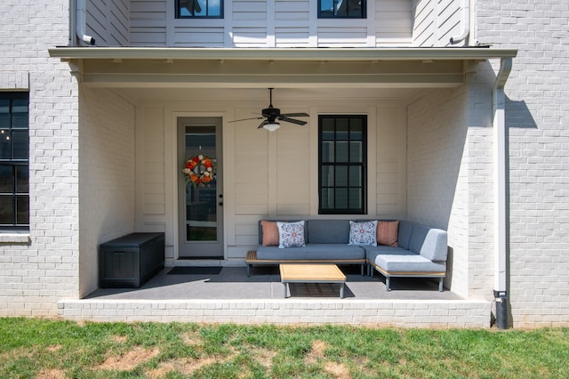 2618 Buckner Ln, Thompsons Station, TN 37179 - view of exterior entry featuring ceiling fan, brick siding, and an outdoor living space
