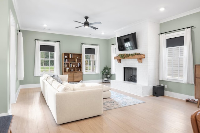 2618 Buckner Ln, Thompsons Station, TN 37179 - living area with ceiling fan, a fireplace, light wood finished floors, recessed lighting, and ornamental molding