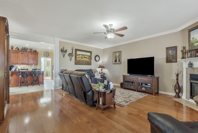 973 Rip Steele Rd, Columbia, TN 38401 - living area with a ceiling fan, light wood finished floors, crown molding, and a fireplace