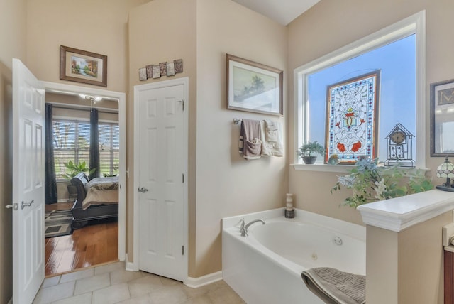 973 Rip Steele Rd, Columbia, TN 38401 - full bath featuring a jetted tub, tile patterned floors, and connected bathroom