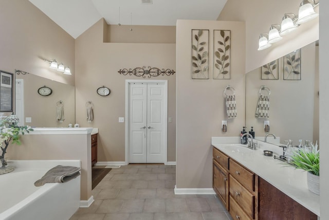 973 Rip Steele Rd, Columbia, TN 38401 - bathroom with vanity, a garden tub, tile patterned floors, and high vaulted ceiling