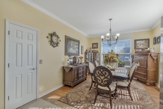 973 Rip Steele Rd, Columbia, TN 38401 - dining area featuring a chandelier, ornamental molding, and light wood-style flooring