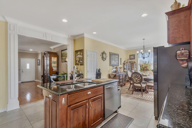 973 Rip Steele Rd, Columbia, TN 38401 - kitchen with appliances with stainless steel finishes, light tile patterned flooring, healthy amount of natural light, crown molding, and a chandelier