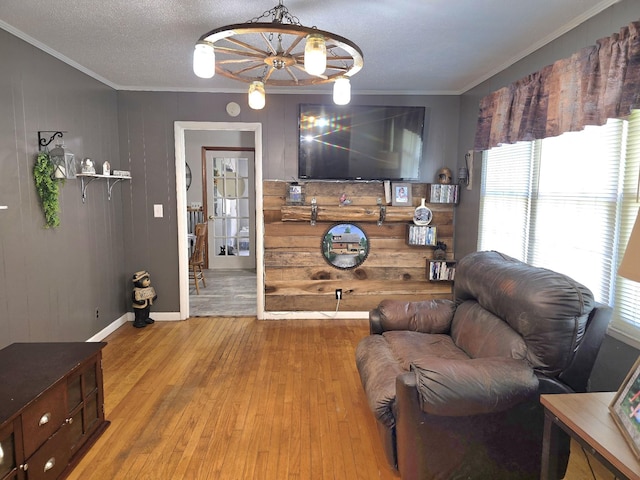 5840 Scottsville Rd, Lafayette, TN 37083 - living area featuring crown molding, light wood-style flooring, and wooden walls