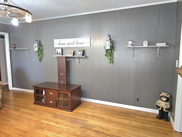 5840 Scottsville Rd, Lafayette, TN 37083 - detailed view of wood finished floors, ornamental molding, and a textured ceiling