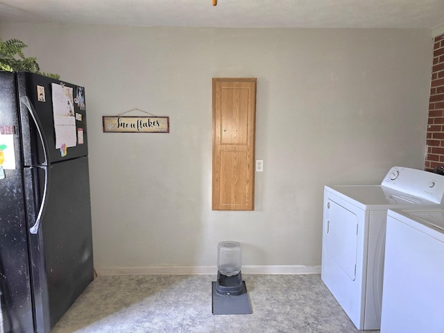 5840 Scottsville Rd, Lafayette, TN 37083 - washroom with washing machine and clothes dryer and baseboards