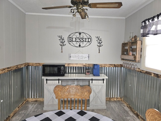 5840 Scottsville Rd, Lafayette, TN 37083 - kitchen with black microwave, wood finished floors, crown molding, a ceiling fan, and a textured ceiling