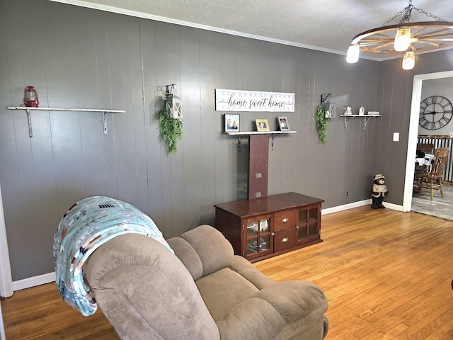 5840 Scottsville Rd, Lafayette, TN 37083 - living area with wood finished floors, crown molding, a textured ceiling, and ceiling fan