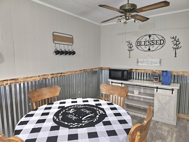 5840 Scottsville Rd, Lafayette, TN 37083 - dining space featuring ornamental molding, wood finished floors, ceiling fan, and a textured ceiling