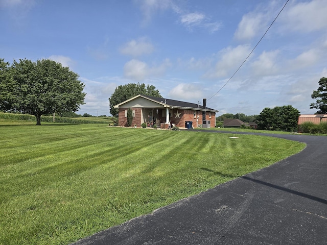 5840 Scottsville Rd, Lafayette, TN 37083 - view of front of home with a front yard and brick siding