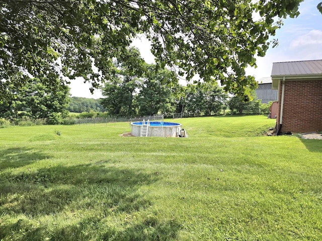 5840 Scottsville Rd, Lafayette, TN 37083 - view of green lawn with an outdoor pool