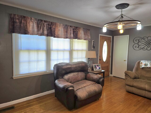 5840 Scottsville Rd, Lafayette, TN 37083 - living room featuring wood finished floors and crown molding