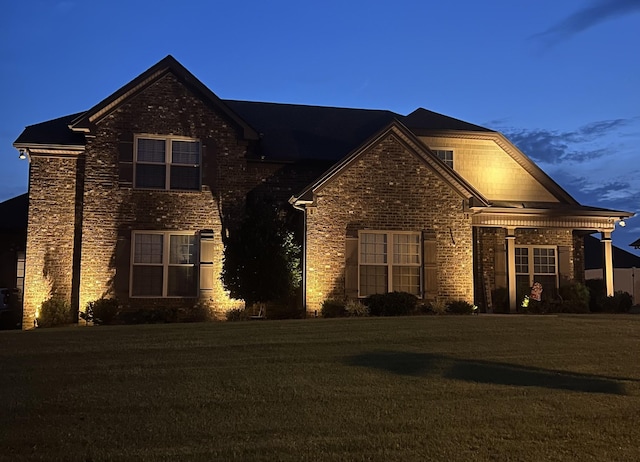 2426 Telford Ln, Murfreesboro, TN 37128 - traditional-style house featuring a front lawn, stone siding, and brick siding