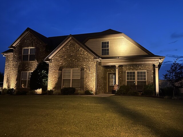 2426 Telford Ln, Murfreesboro, TN 37128 - traditional home with a porch, a front yard, and brick siding