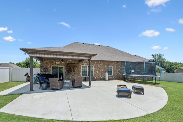 2426 Telford Ln, Murfreesboro, TN 37128 - back of house featuring a trampoline, a patio area, a ceiling fan, brick siding, and a fenced backyard