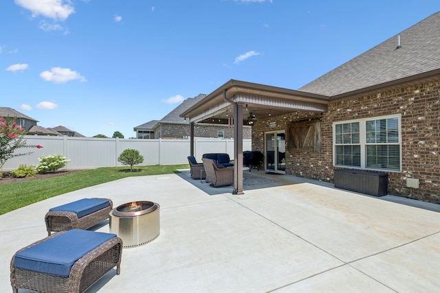 2426 Telford Ln, Murfreesboro, TN 37128 - fenced backyard with a patio, ceiling fan, and an outdoor living space with a fire pit