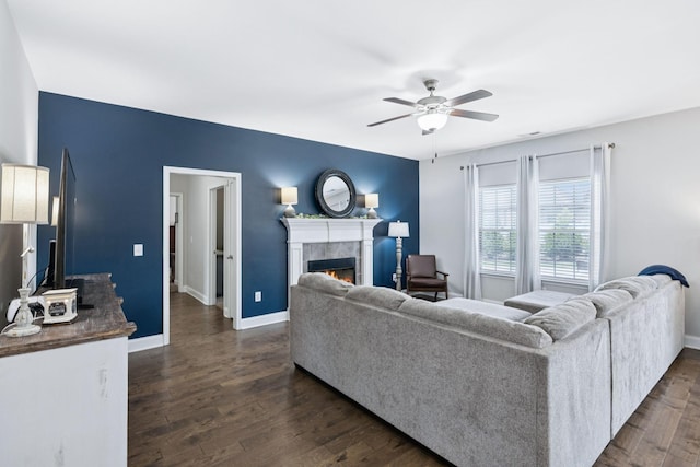 2426 Telford Ln, Murfreesboro, TN 37128 - living area with a tiled fireplace, ceiling fan, and dark wood finished floors