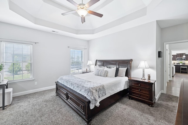 2426 Telford Ln, Murfreesboro, TN 37128 - bedroom with a raised ceiling, multiple windows, carpet flooring, and a ceiling fan
