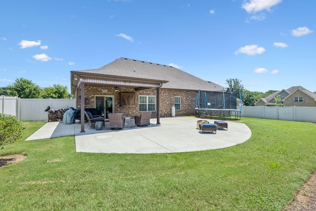2426 Telford Ln, Murfreesboro, TN 37128 - back of property featuring a trampoline, a patio, a ceiling fan, brick siding, and a fenced backyard