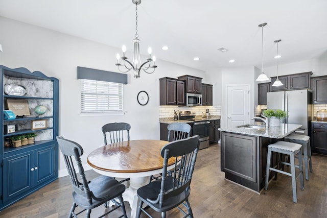 2426 Telford Ln, Murfreesboro, TN 37128 - dining room with a chandelier, recessed lighting, and dark wood-type flooring