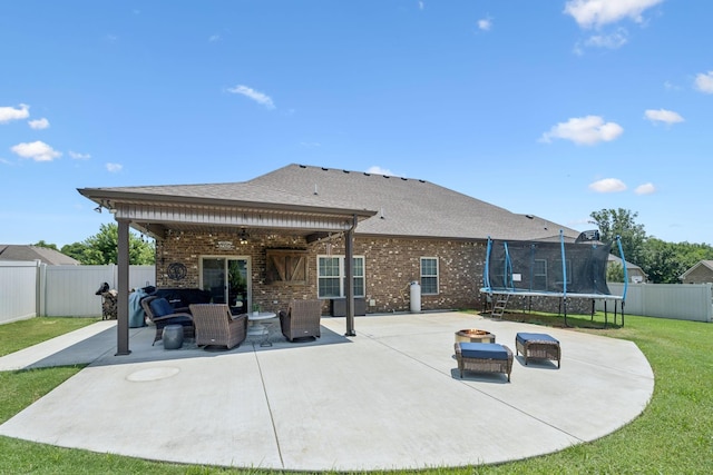 2426 Telford Ln, Murfreesboro, TN 37128 - back of house with a trampoline, a patio area, ceiling fan, brick siding, and a fenced backyard